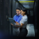 Server Room, Laptop And Technician People For Software Management