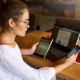 Side View Of Woman In Glasses Working With Multiple Electronic Internet Devices