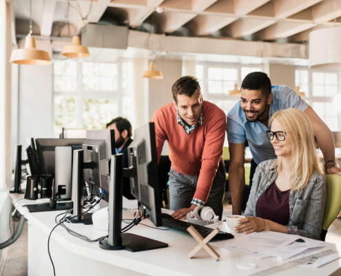 Young People Working Together On A Project In A Startup Company Office
