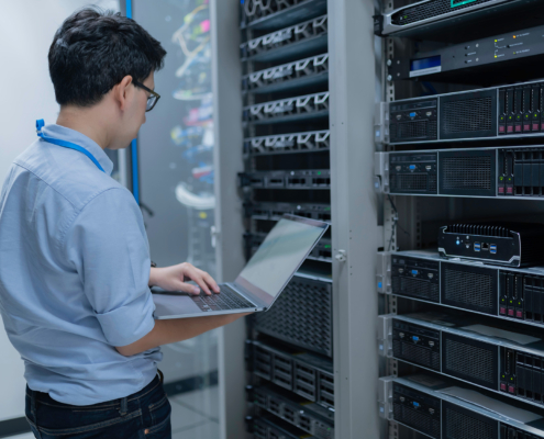 Computer Engineer Is Setting Up Network In Server Room