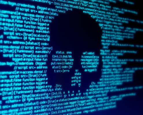 Computer Code On A Screen With A Skull Representing A Computer Virus Malware Attack