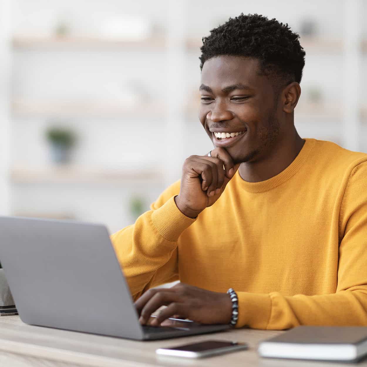 Header Side View Of Smiling Man On Laptop