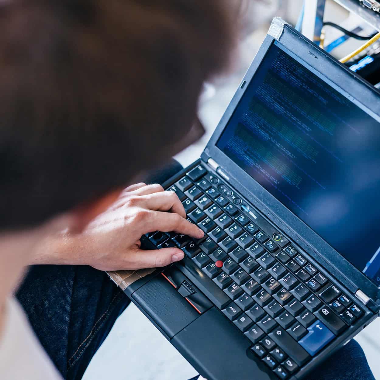 Header Top Down View Of Man On Laptop Computer
