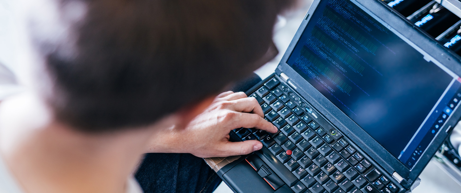 Top Down View Of Man On Laptop Computer