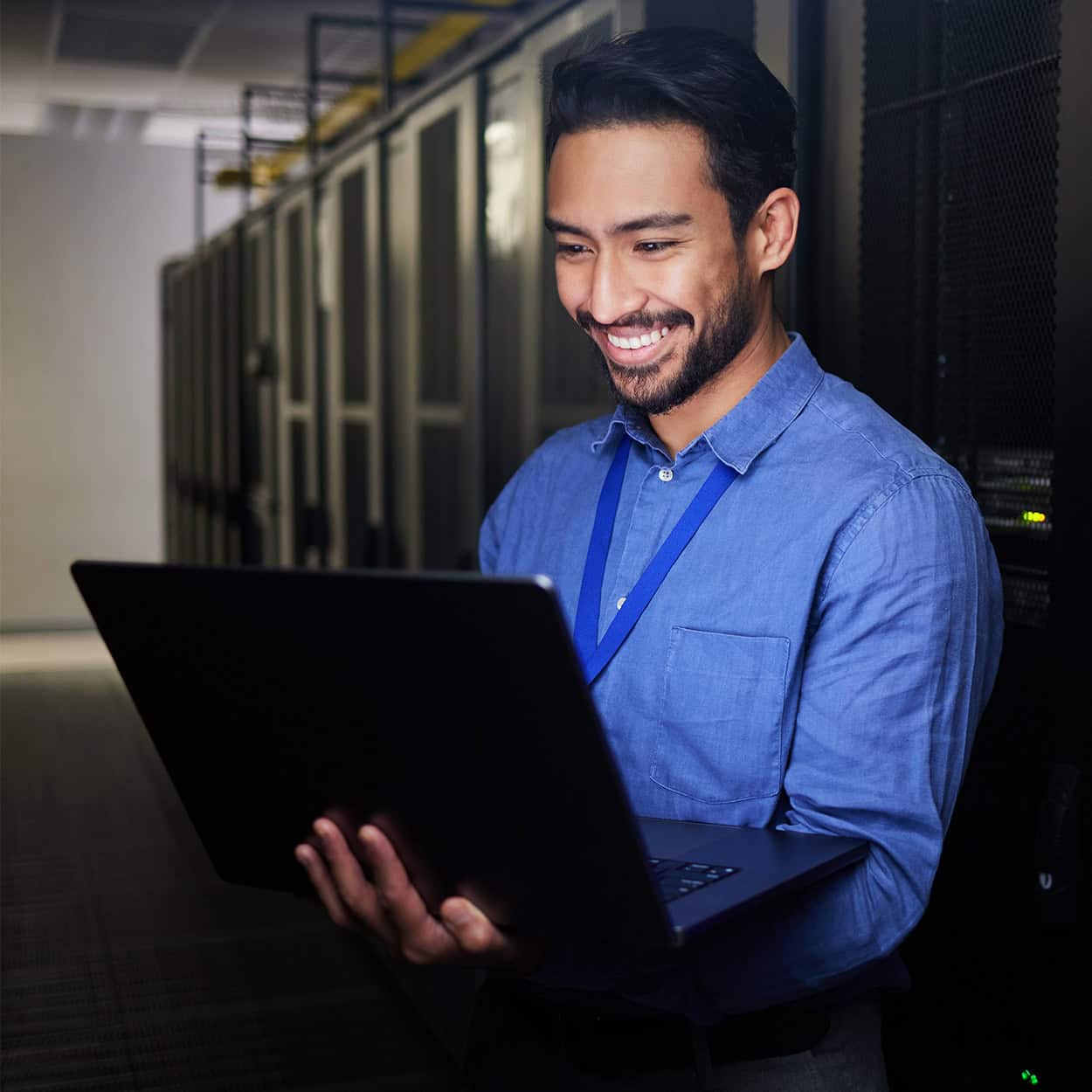 Header Front View Of Man On Laptop Computer Smiling