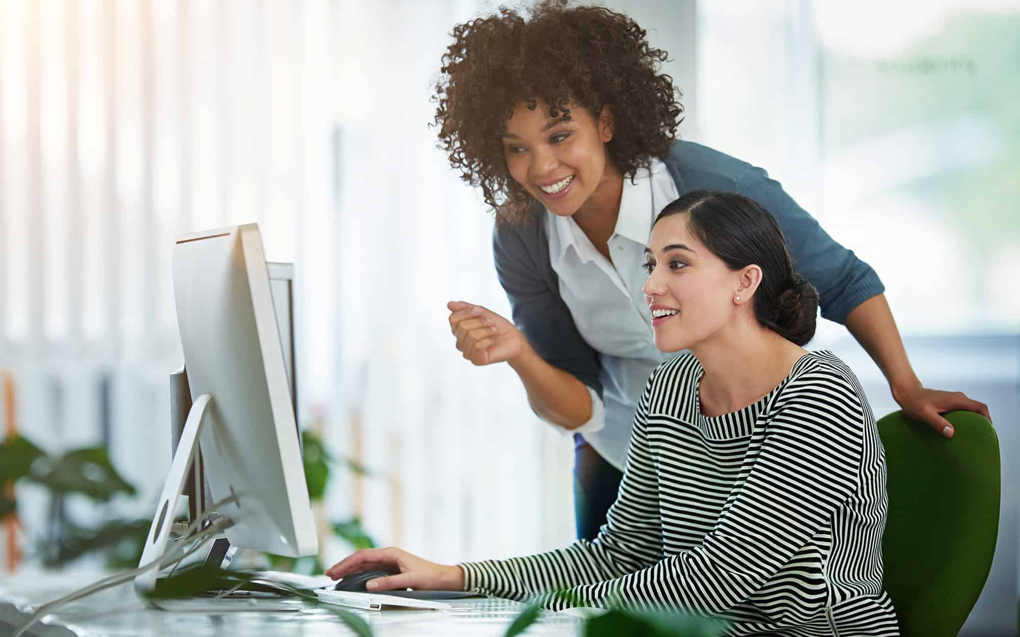 Side View Of It Professional Helping Woman On Computer