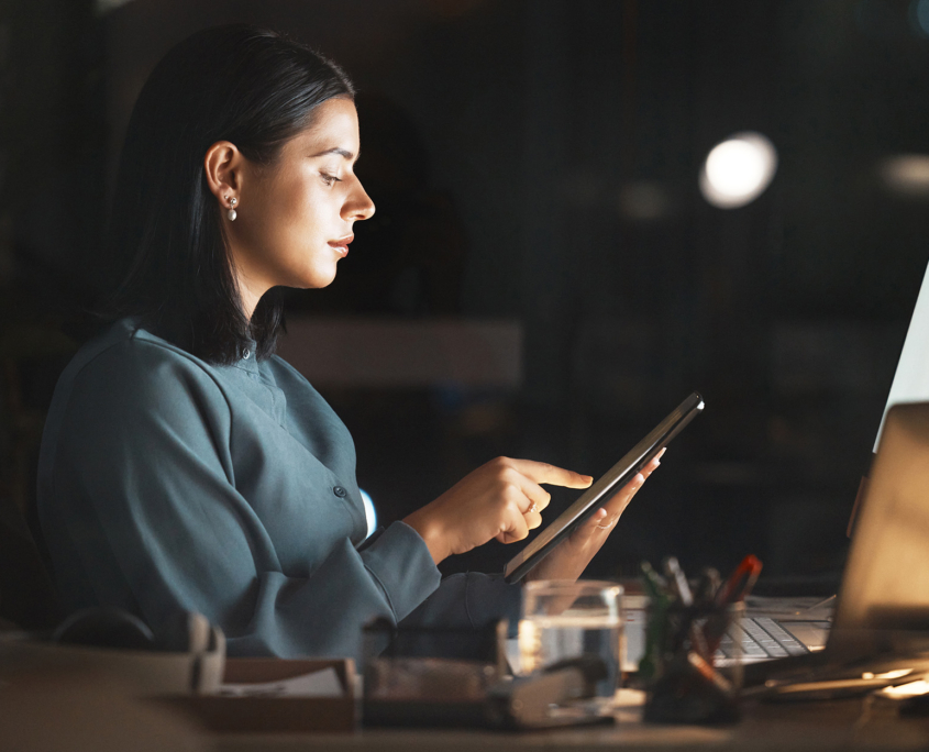 Side View Of Woman Interacting With Smart Tablet