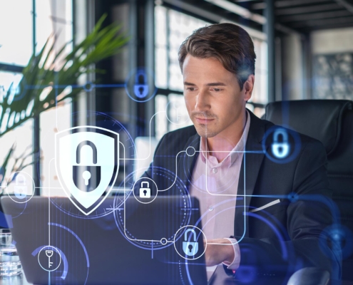 Business person in office using secure laptop