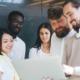 Team Of Smiling Multiracial Crew Of Skilled It Professionals Enjoying Cooperation