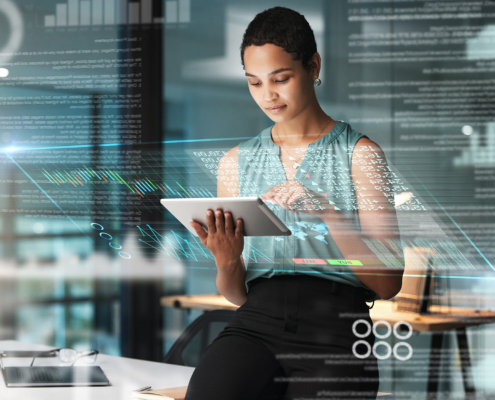 Black Woman With Tablet, Erp Overlay And Charts